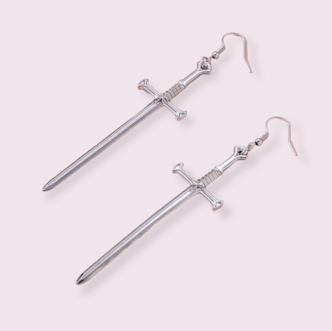 Make a statement with these stunning sword earrings, perfect for anyone trying to edge up their jewellery collection. Pendant size roughly 5.5cm for Medium and 8cm for Large. Material: zinc alloy. If you have a nickel allergy, please add a note to your order at checkout and I’ll switch the alloy hooks to nickel free hooks.