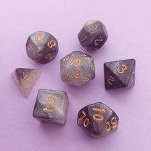 Load image into Gallery viewer, This set is a mixture of different grey shimmer hues resembling the galaxy.

We&#39;re trying out something new and these stunning limited addition resin DnD dice are just a little teaser before we hopefully launching our own custom dice range later this year. All of our dice will be limited and mostly will not be restocked as each batch comes out differently. Please note each set will be different to the next depending on the pour.
