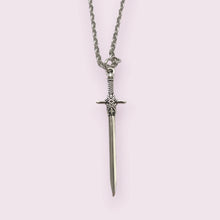 Load image into Gallery viewer, Make a statement with these stunning sword necklaces, perfect for anyone trying to edge up their jewellery collection, plus they look amazing with our sword earrings. Pendant size roughly 4.7cm. Material: zinc alloy.
