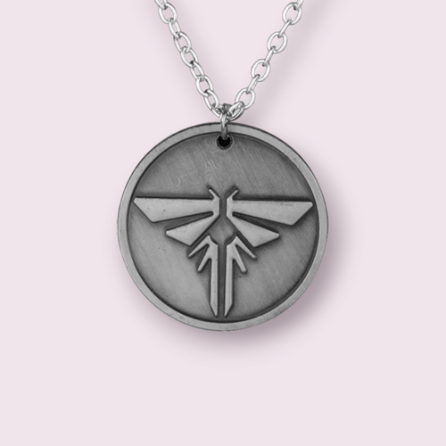 This stunning necklace is sure to delight any fans of the Last of Us game and / or series. Depicting the firefly symbol on the one side and 