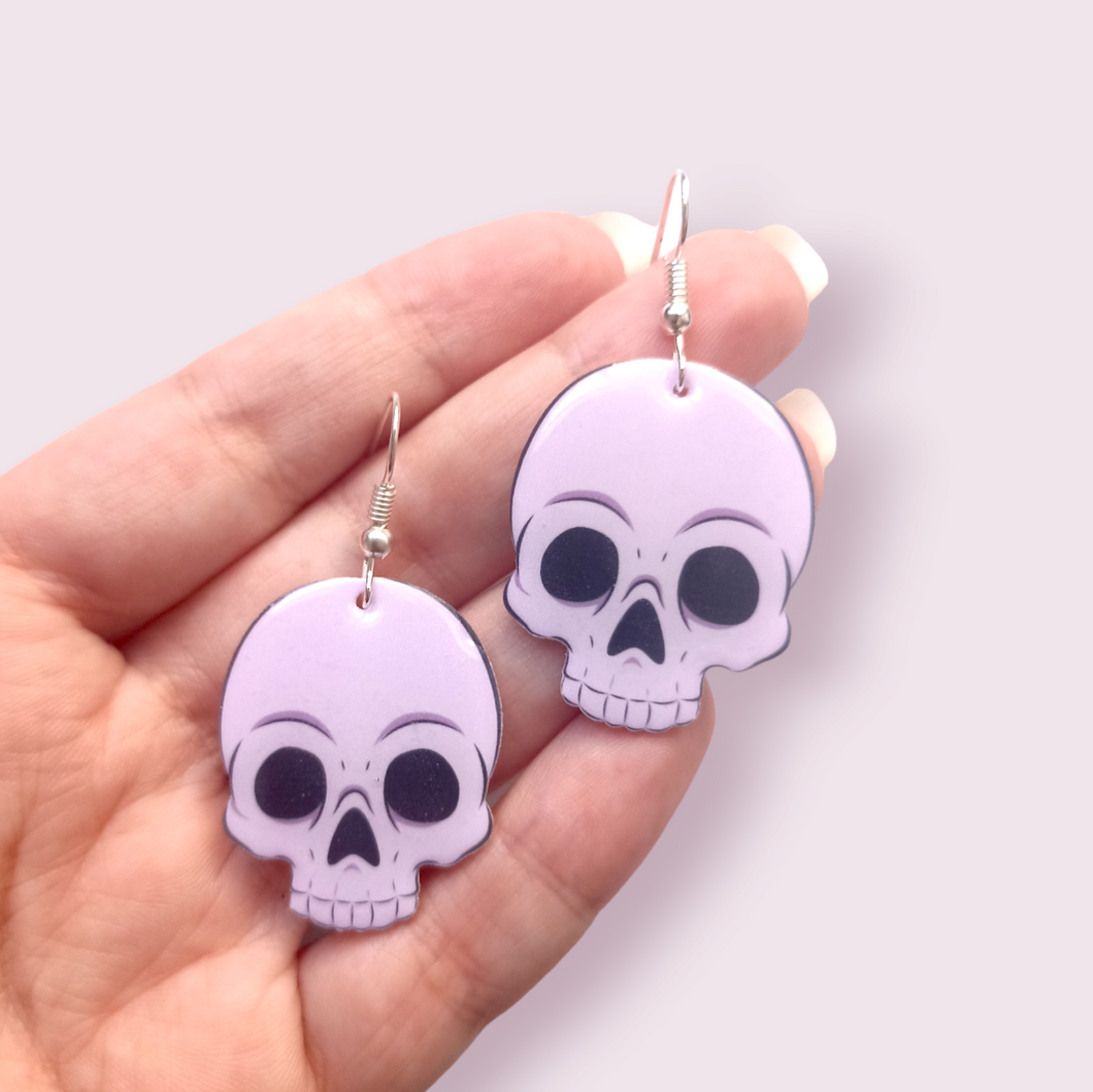 How cute are these little skulls? These stunning earrings are designed and made in-house and are also available in grey. Material: shrink film, resin, nickel free hooks. Please note as these are all handmade, minor differences may occur from piece to piece.  All shrink film products can take about a week to send out as they are currently made to order