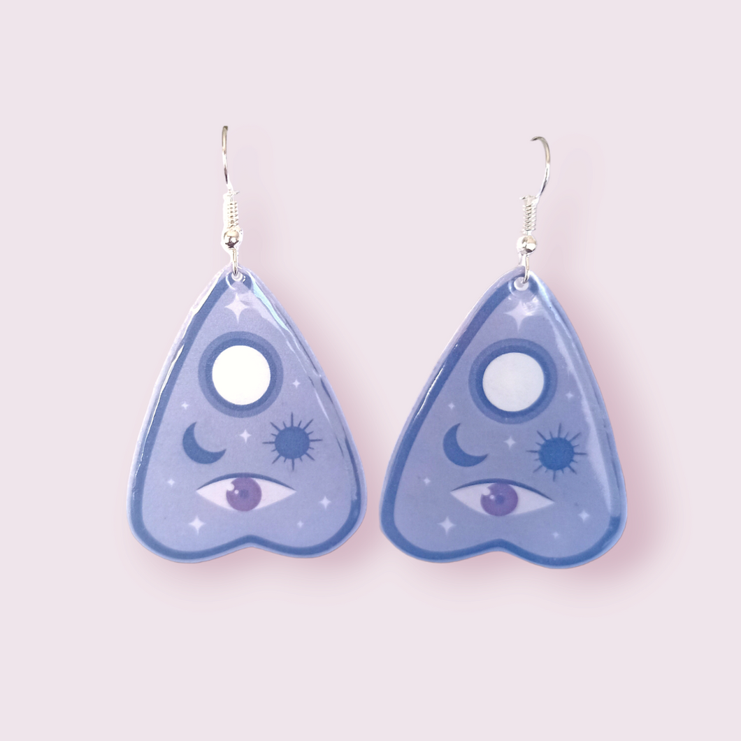 These stunning earrings are designed and made in-house. Material: shrink film, resin, nickel free hooks. Please note as these are all handmade, minor differences may occur from piece to piece.  All shrink film products can take about a week to send out as they are currently made to order