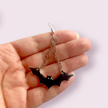 Load image into Gallery viewer, These spooky little guys are sure to delight any alt babe. These stunning earrings are designed and made in-house. Hanging length roughly 5cm, width 4.5cm. Material: shrink film, resin, nickel free hooks. Please note as these are all handmade, minor differences may occur from piece to piece. Matching necklace coming soon
