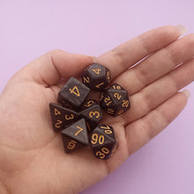 Load image into Gallery viewer, We&#39;re trying out something new and these stunning limited addition resin DnD dice are just a little teaser before we hopefully launching our own custom dice range later this year. All of our dice will be limited and mostly will not be restocked as each batch comes out differently. Please note each set will be different to the next depending on the pour.
