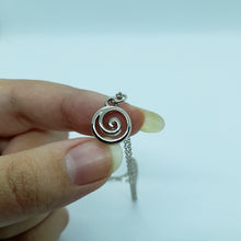 Load image into Gallery viewer, A unique gift for those who are drawn to spirituality, physics and The Golden Ratio. Pendant Size Roughly 1.2cm. Material: zinc alloy. Locally sourced and handmade by The Raven’s Claw.
