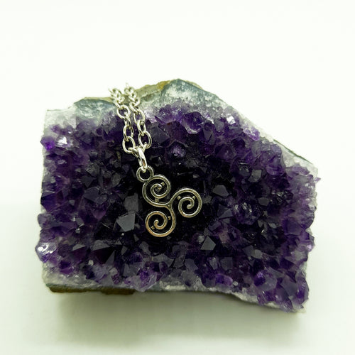 A unique gift for those who are drawn to spirituality and ancient Celtic symbolism. Also known as a Triskelion. Pendant Size Roughly 1.4cm. Material: zinc alloy. Locally sourced and handmade by The Raven’s Claw. 