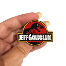 Load image into Gallery viewer, My new favourite pin! A unique gift for any fans of Jurassic park and World. Pendant Size 3x4.3cm. Material: Zinc Alloy 
