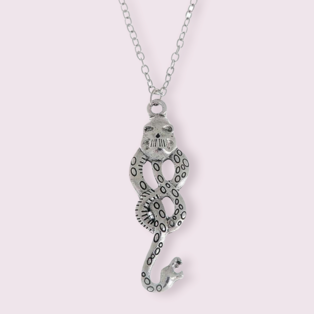 This stunning necklace is inspired by the dark mark which Voldemort uses to summon his followers. The perfect staple piece for any Harry Potter fan. Material: Zinc Alloy. Pendant size roughly 5x2.7cm