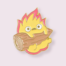 Load image into Gallery viewer, A heart-warming gift for those who are fans of the beloved Studio Ghibli anime “Howl’s Moving Castle”, inspired by the fire demon Calcifer who fuels Howl’s castle. Pin Size Roughly 3cm. Material: Enamel and zinc alloy 
