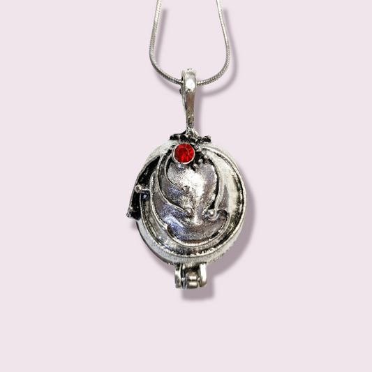 A unique gift for any fans of the hit series, The Vampire Diaries. This piece is inspired by the necklace Elena wears to prevent vampires from using "compeltion" on her. Pendant Size Roughly 2x3cm. Material: Zinc Alloy. The pendant can open and has a magnetic piece holding it closed. 