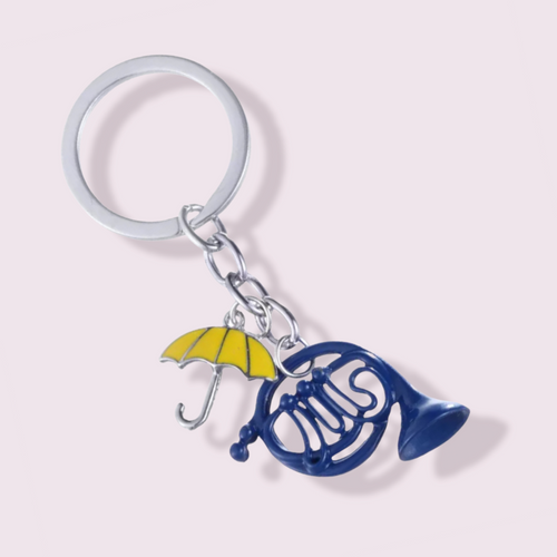 A unique gift for any fans of the hit TV series, How I Met Your Mother. This Keyring depicts the iconic blue French horn and yellow umbrella which are very important to the series. Pendant Size Roughly 3cm. Material: Zinc Alloy 