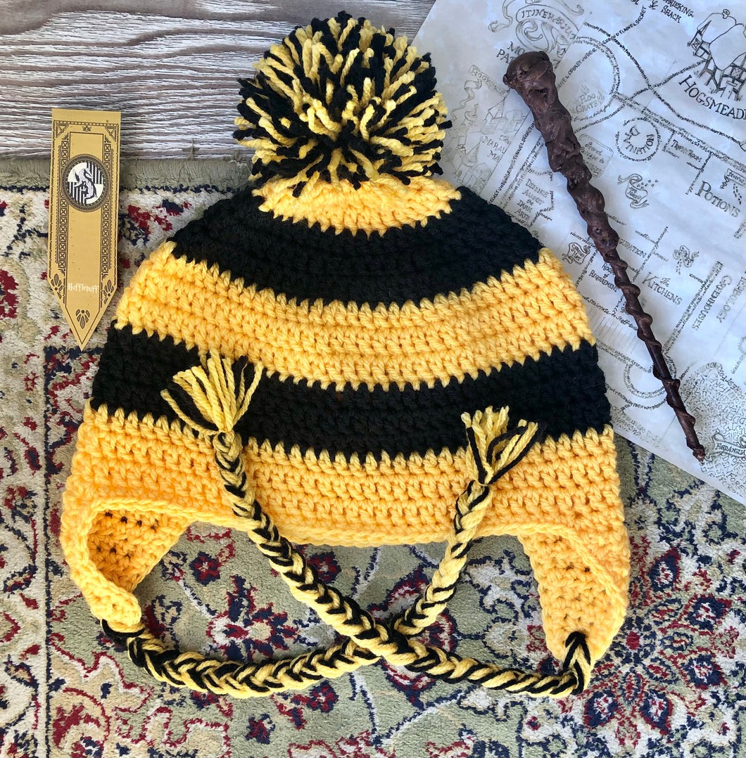 This incredible crochet beanie was created as an exclusive item for The Raven’s Claw by the talented artist Whimsy Wool. Each beanie is entirely made by hand. Perfect for any Harry Potter fan in house Hufflepuff. Size: Adult Large – Wash on delicate 
