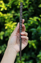 Load image into Gallery viewer, A must have for any Harry Potter fan. These incredible wands were hand created as an exclusive item for The Raven’s Claw by the talented artist Jaded Dragon Creations. Each wand is sculpted, hand cast and individually painted and takes multiple days to make a single wand. Wands measure at roughly 27cm and are made from a flexible material to aid in durability. As they are all made by hand, some slight differences may appear between wands. Wand care: do not bend and avoid contact with moisture.
